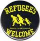 Zum 37mm Magnet-Button "Refugees welcome (gelb/schwarz)" für 2,50 € gehen.