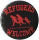 Zum 50mm Magnet-Button "Refugees welcome (rot)" für 3,00 € gehen.